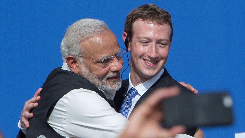 Indian Prime Minister Narendra Modi (left) and Facebook CEO Mark Zuckerberg (right) hug after the discussion