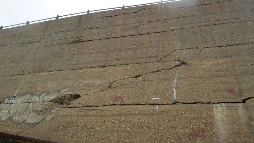 Cracks in the sea wall at Folkestone