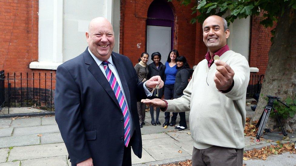 Jayalal Madde with the Liverpool mayor Joe Anderson getting his home