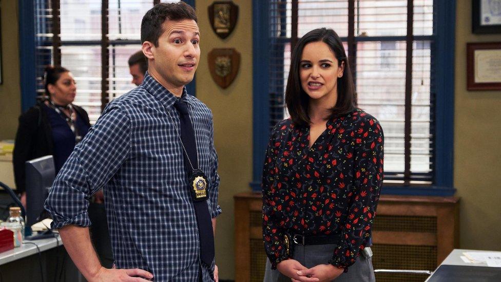 Andy Samberg and Melissa Fumero