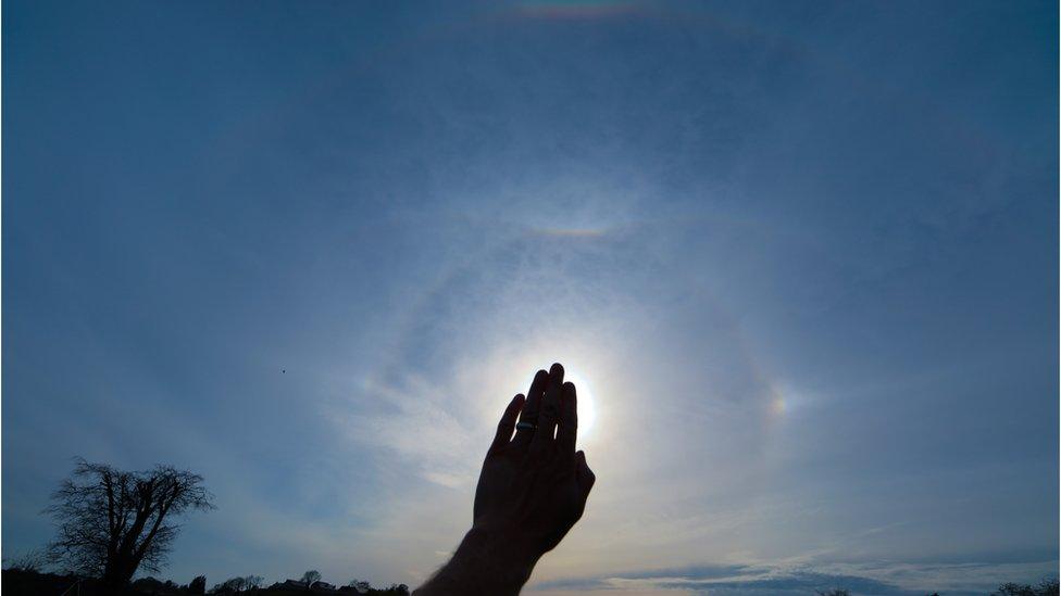 Rare complex display ... You need something more sophisticated than a camera phone to get this shot. On display are Sundogs, a long Parhelic Circle, Upper Tangent Arc, 22 degree sun halo, a Circumzenithal Arc which resembles a smiling rainbow and a rare Supralateral Arc