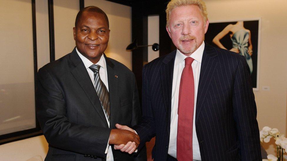 Handout photograph released by Irle Moser Rechtsanwaite on June 19, 2018, shows the President of Central African Republic Faustin Archange Touadera (L) as he shakes hands with former German tennis player Boris Becker in Brussels on April 27, 2018