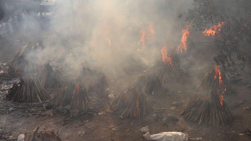 A body of a person who died from the coronavirus disease (COVID-19), during a mass cremation, at a crematorium in New Delhi, India on May 01, 2021