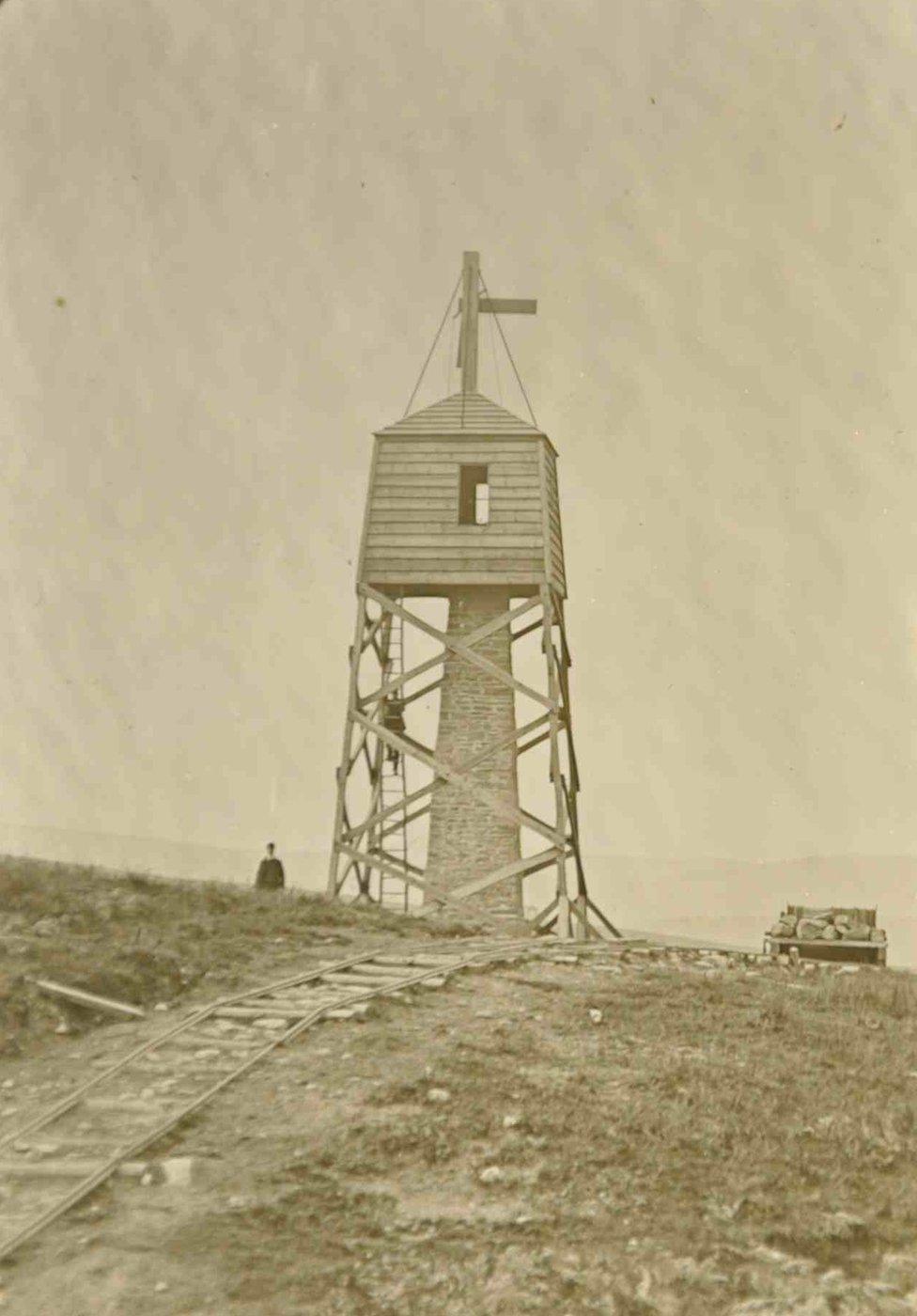 siteline worker showing one of many observatories which were constructed along the route of the aqueduct which were up to about 60ft high and were used by workers operating theodolite-like devices to measure and check the route of the aqueduct