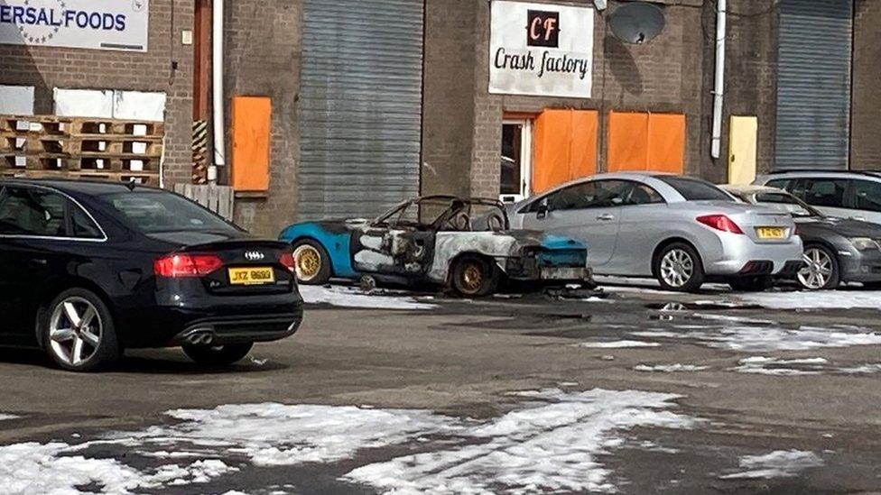 Burnt out sports car in Newtownards business park