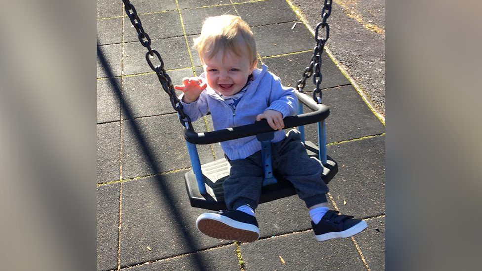 Toddler in swing