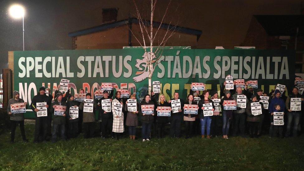 Protesters held placards opposing a hard border