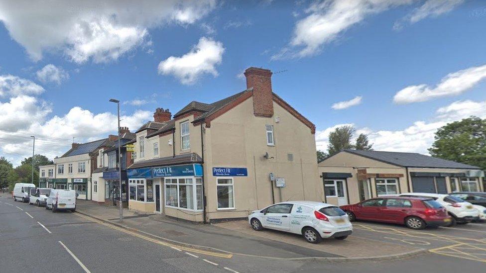 Street view of a terrace of offices and businesses