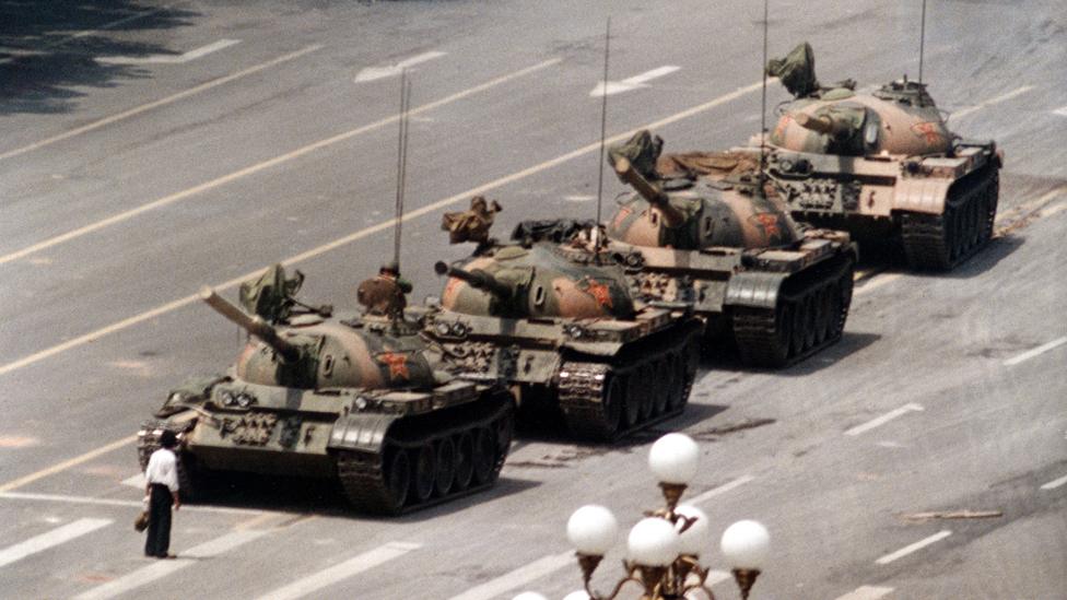 June 5, 1989 file photo, a Chinese man stands alone to block a line of tanks heading east on Beijing"s Cangan Blvd. in Tiananmen Square.