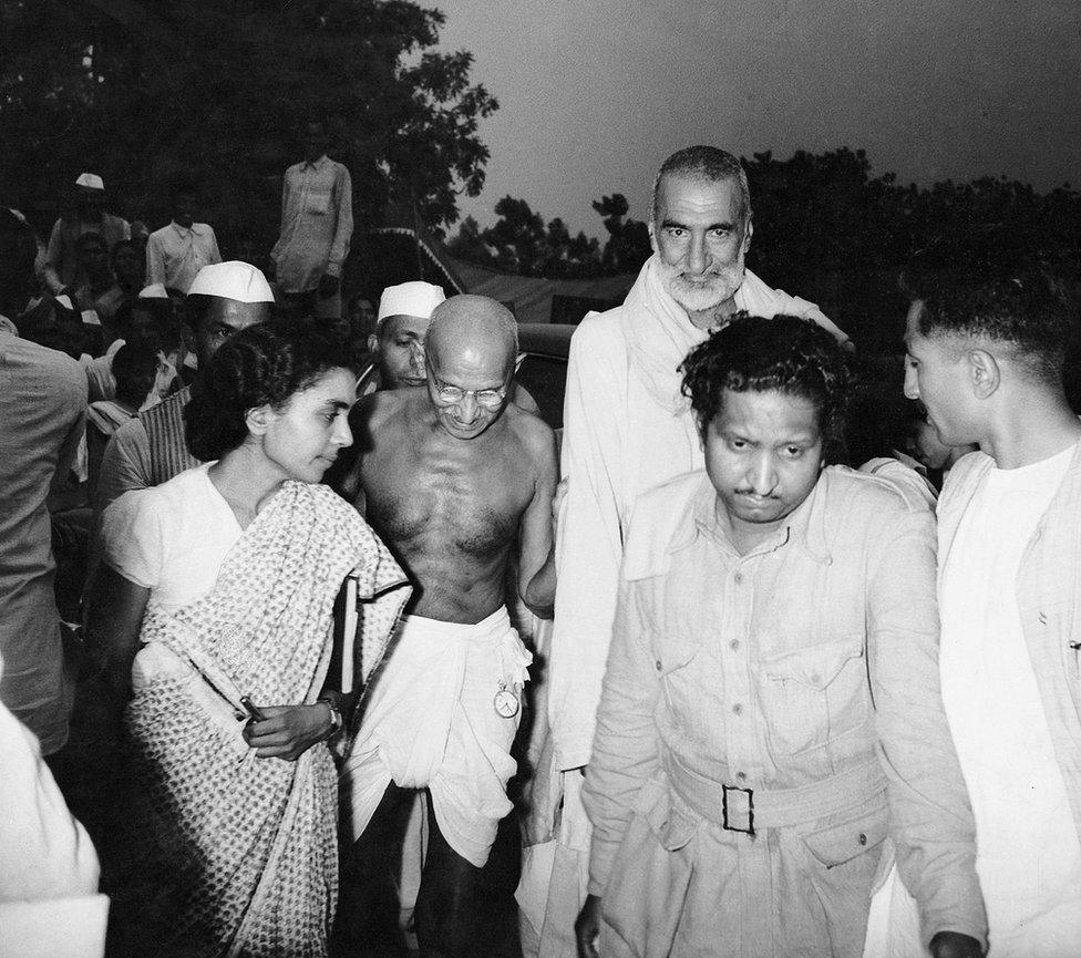 Gandhi with Khan Abdul Ghafar Khan and Sushila Nayar, his personal physician, arrive for a meeting.