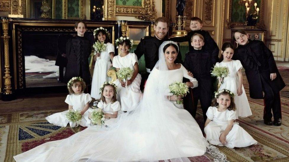 group photograph of Prince Harry and Meghan surrounded by bridesmaids and pageboys