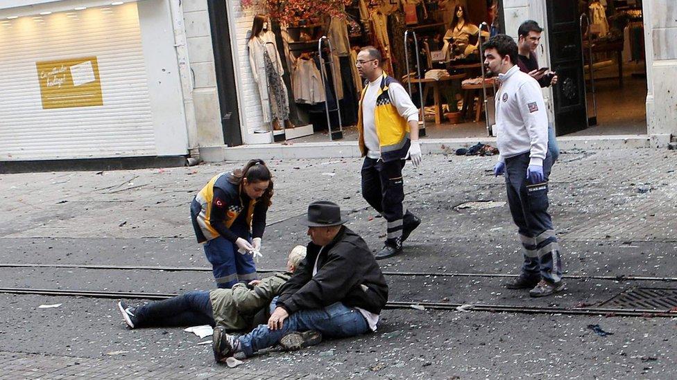 Medics try to help wounded people after the 19 March bombing in Istanbul. Following the attacks in Brussels, some social media users claimed recent attacks in Turkey and elsewhere had been downplayed compared to similar attacks in Europe and the West