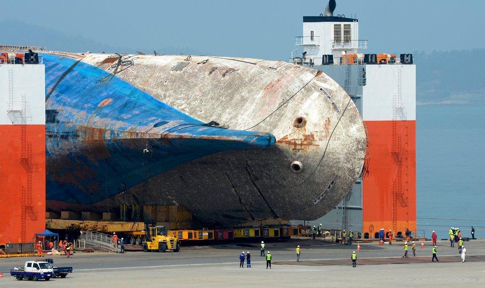 The salvaged Sewol ferry is moved onto land by module transporters to be put on a dry dock at a port in Mokpo, 410 km southwest of Seoul, South Korea, 9 April 2017