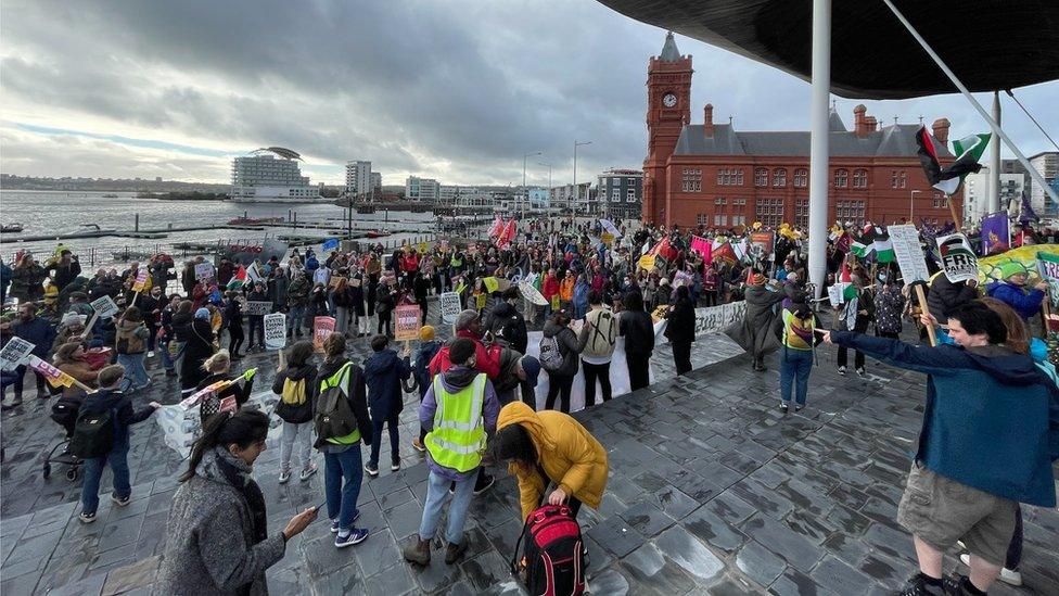 climate protesters gather outside the Senedd