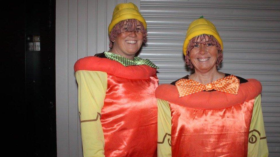 Couple dressed as flower pots