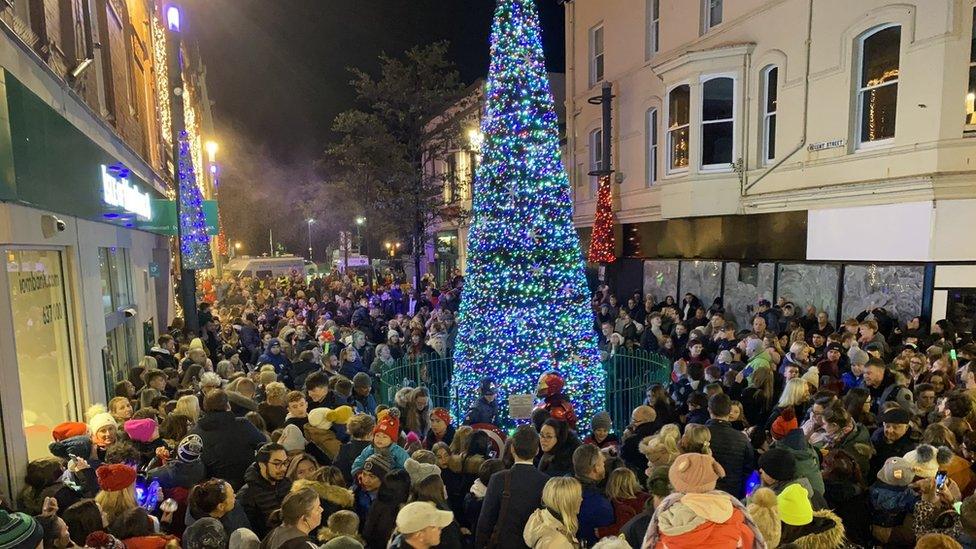 Tree surrounded by crowds