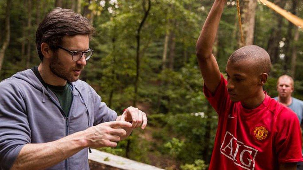 Richard Stephens with a camp student