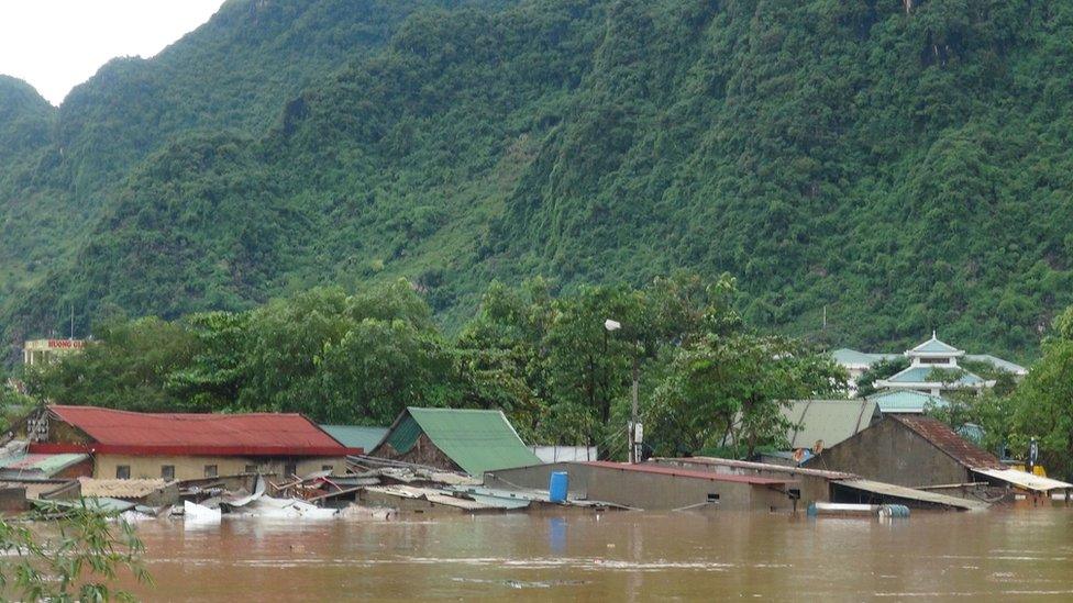 Submerged homes are seen in Bo Trach district of the central Vietnamese province of Quang Binh on 15 October 2016