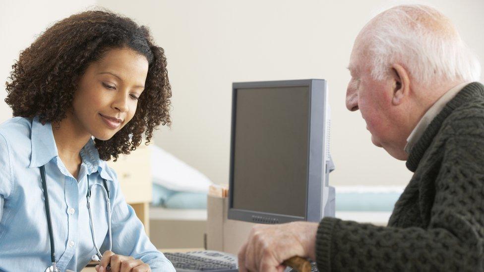 GP talking to a elderly male patient