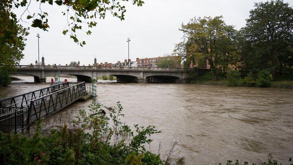 The River Taff flowing at a high level through Cardiff during Storm Callum