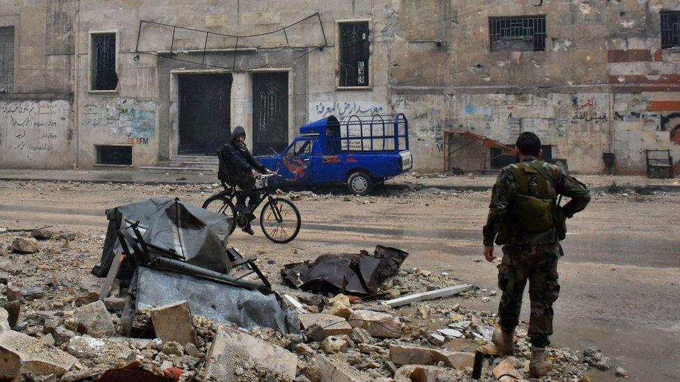 Syrian pro-government forces in Aleppo's newly captured Al-Kalasseh neighbourhood in the eastern part of the war torn city, 13 December 2016