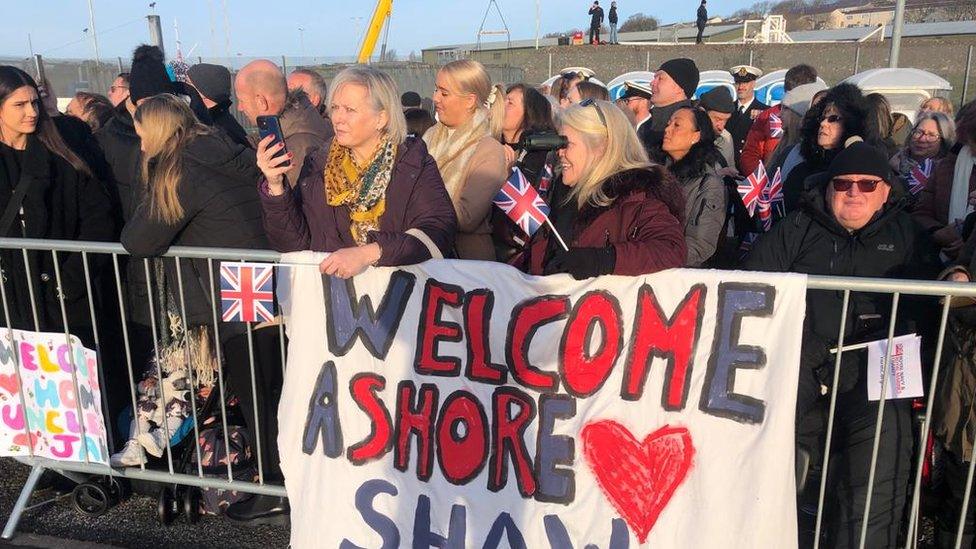 Families in Devonport at the homecoming of HMS Montrose