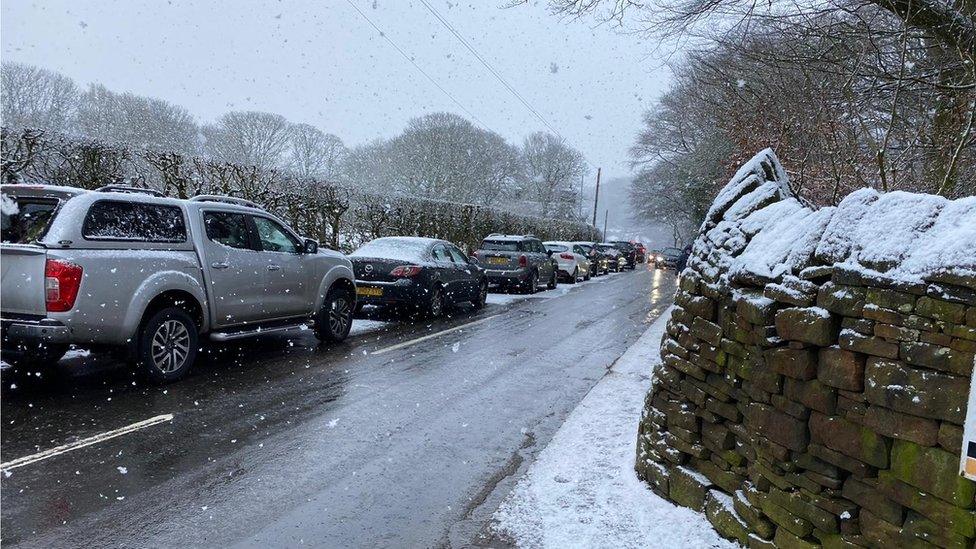 Cars parked on a road near Rivington Pike