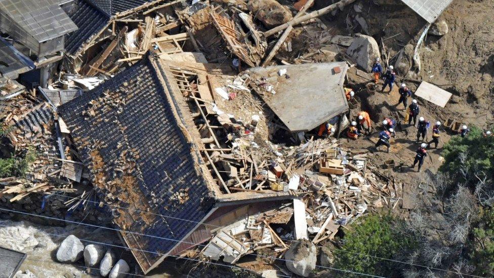 Rescuers at a destroyed building