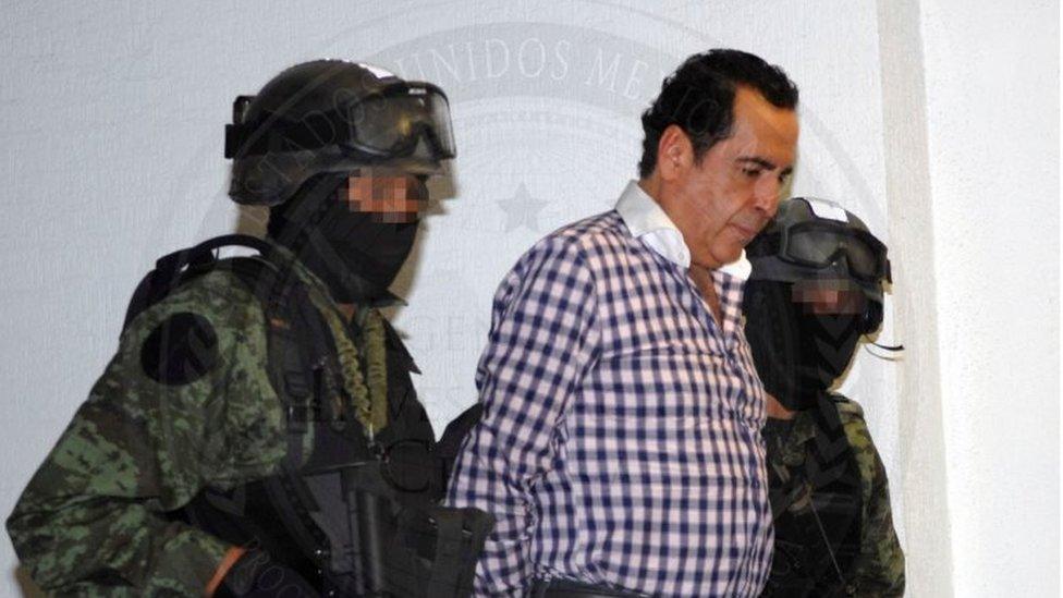 Soldiers escort head of the Beltran Leyva drug cartel Hector Beltran Leyva in Mexico City, in this handout picture taken October 1, 2014