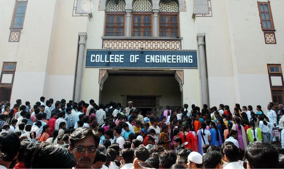 Indian students wait outside an engineering college in Hyderabad.