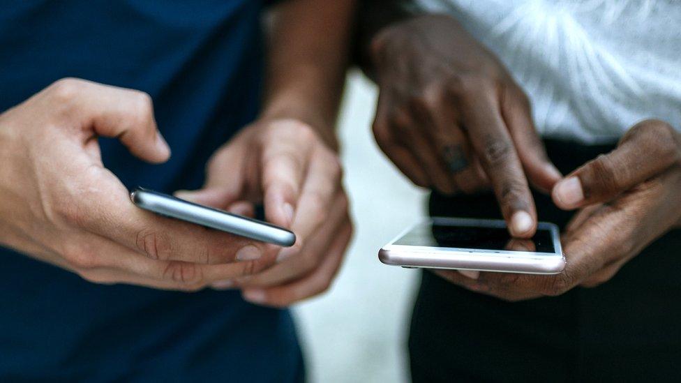 Stock image of two people messaging