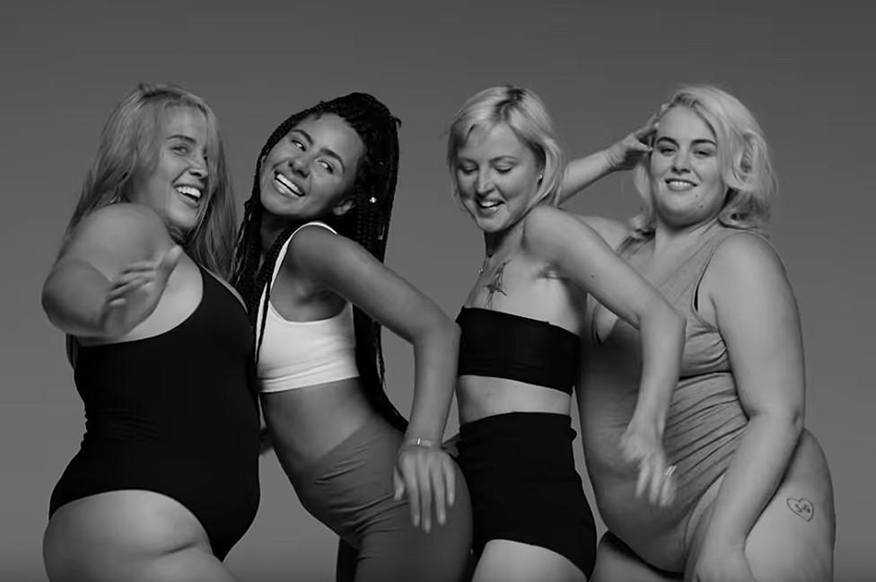 Kris Hallenga (second from right) in the Little Mix video for the song Strip