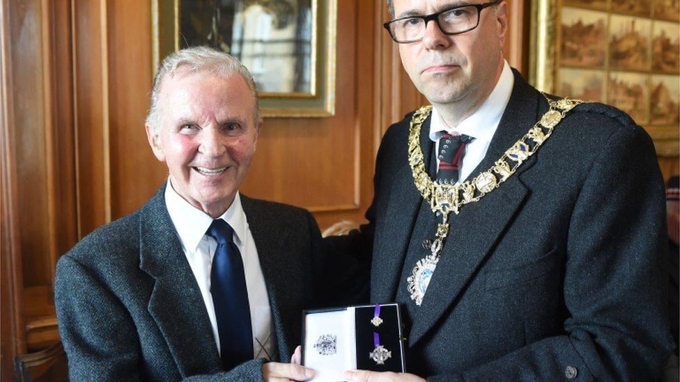 Roy Clark receiving his brother's Elizabeth Cross