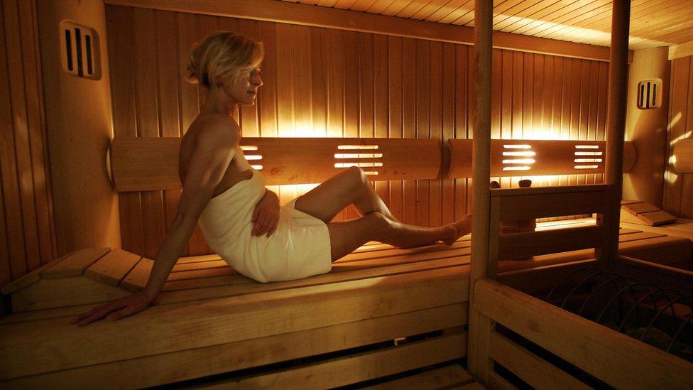 A woman in a sauna in Finland