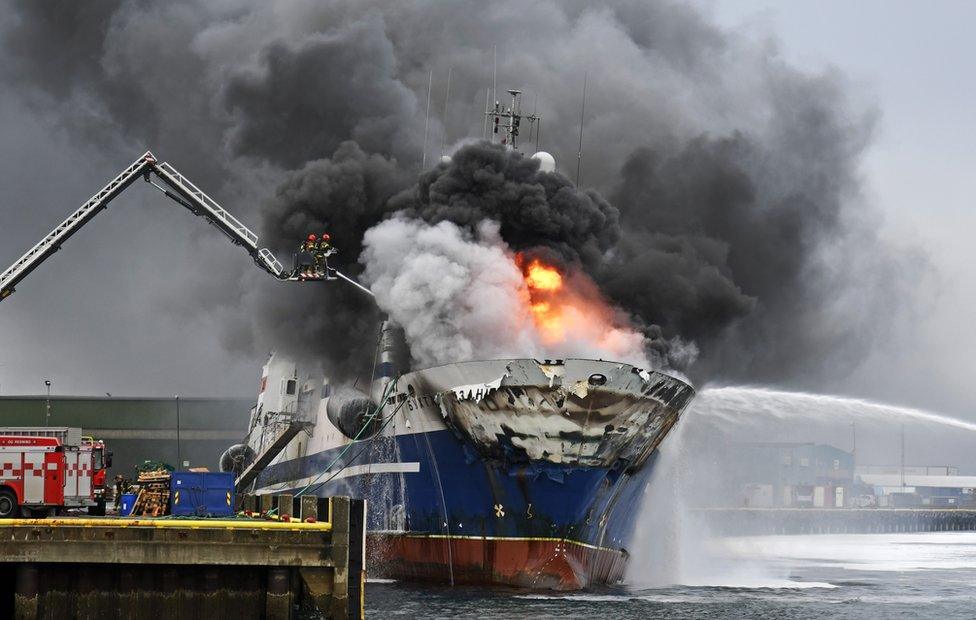 The Russian fishing trawler Bukhta Nayezdnik burns in the harbour of Tromso, northern Norway, 25 September 2019 (issued 26 September 2019).