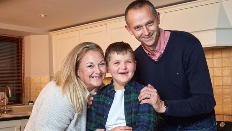 Tommy with his parents