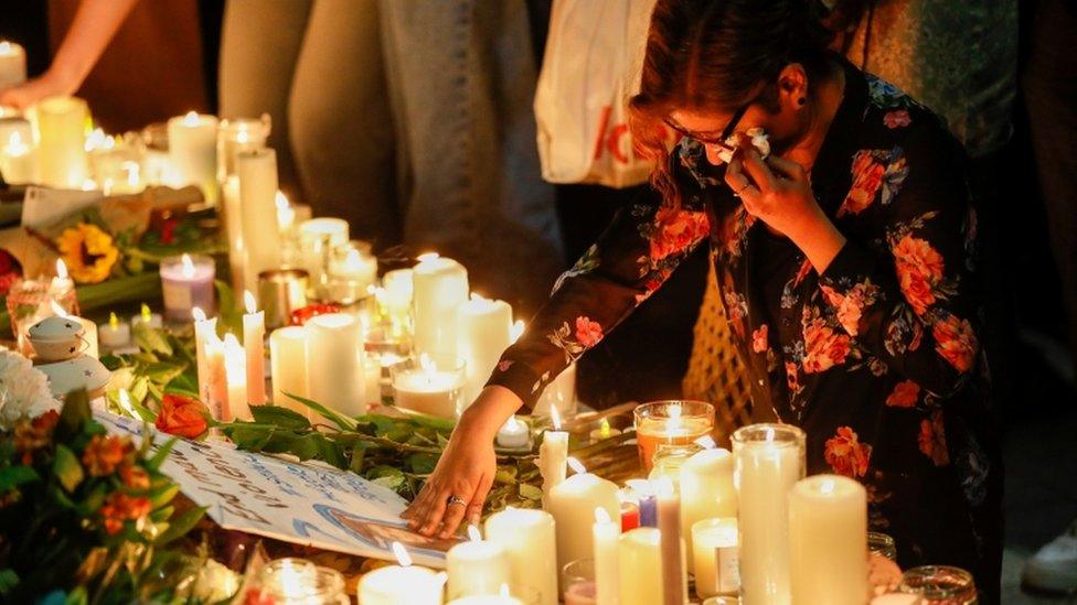 A person reacts during a vigil in memory of Sabina Nessa