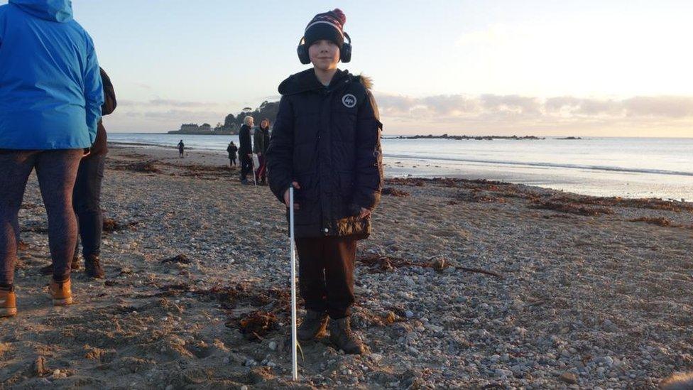 Sam, 10-year-old-boy, on beach