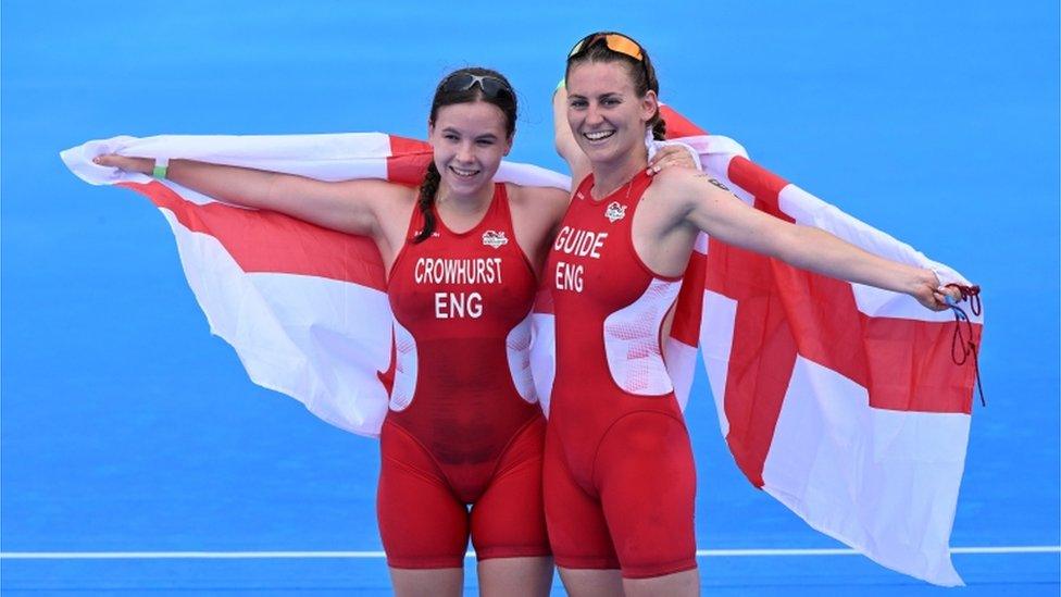 Katie Crowhurst (left) and Jessica Fullagar (right) of England celebrates winning the gold medal in the women's Triathlon PTVI event.