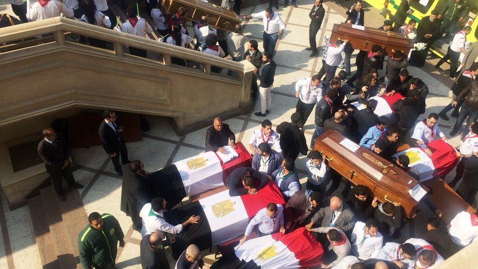 Victims caskets draped in flag