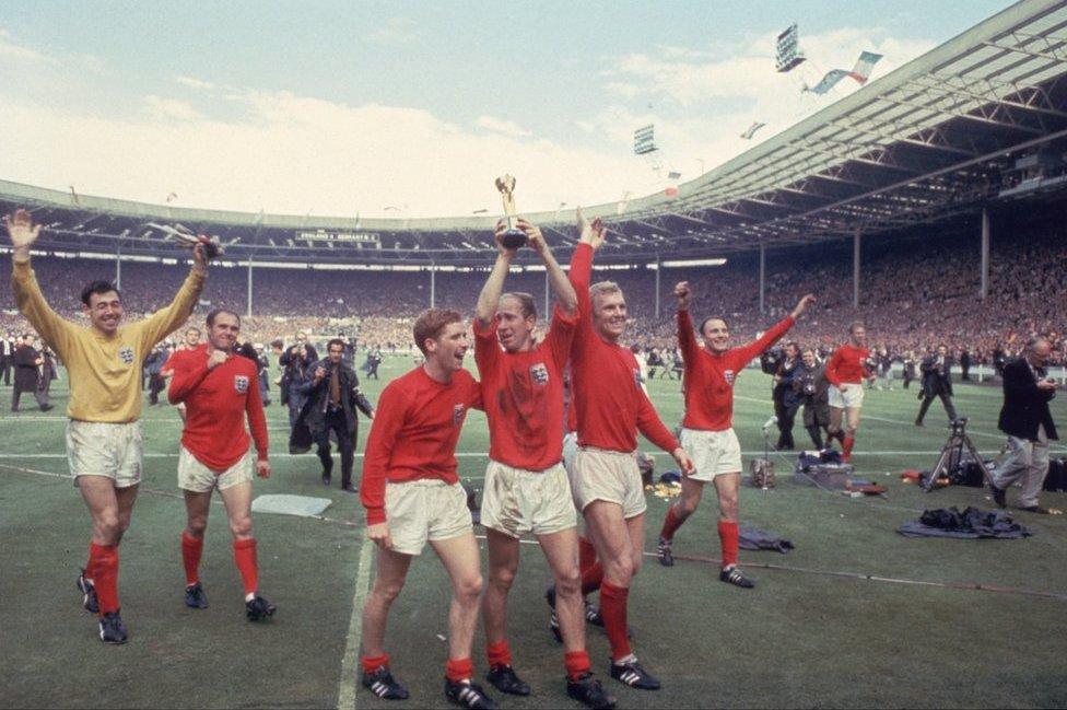 Bobby Charlton raises the Jules Rimet trophy at Wembley alongside his team mates Gordon Banks, Alan Ball and captain Bobby Moore