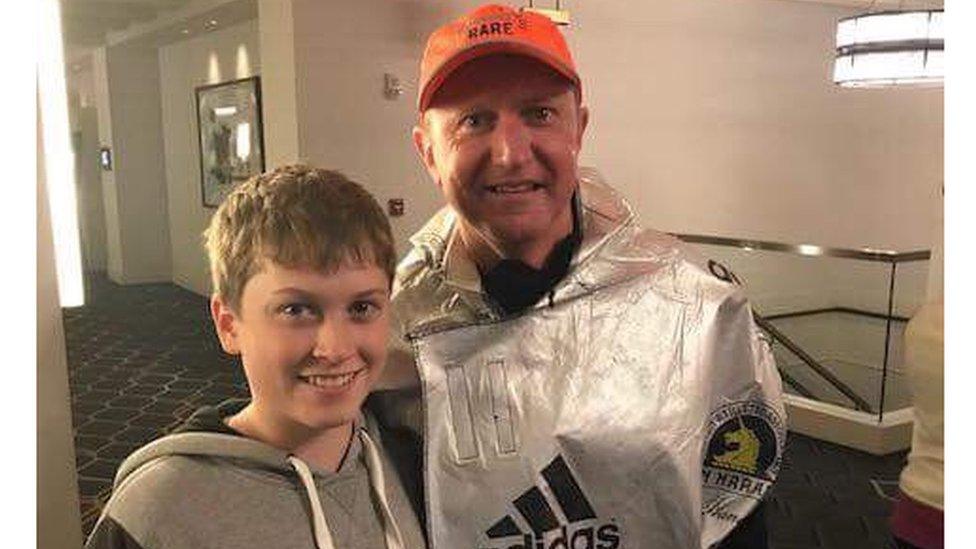 Mr Bayliss with his youngest son, Ollie, after completing the Boston Marathon