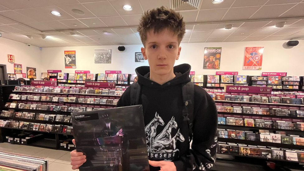 Geordie Breeze holding a vinyl LP