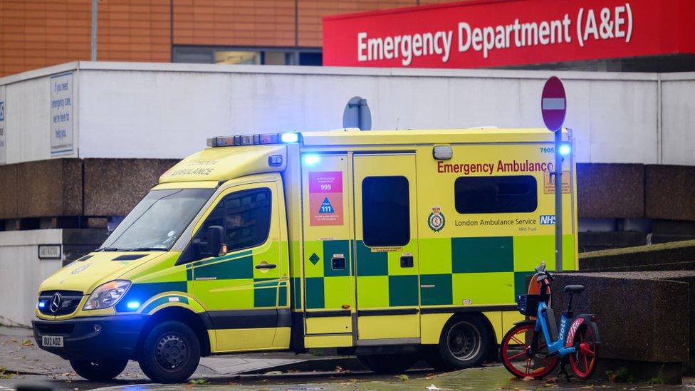 Ambulance exiting Emergency Department at St Thomas' Hospital in London