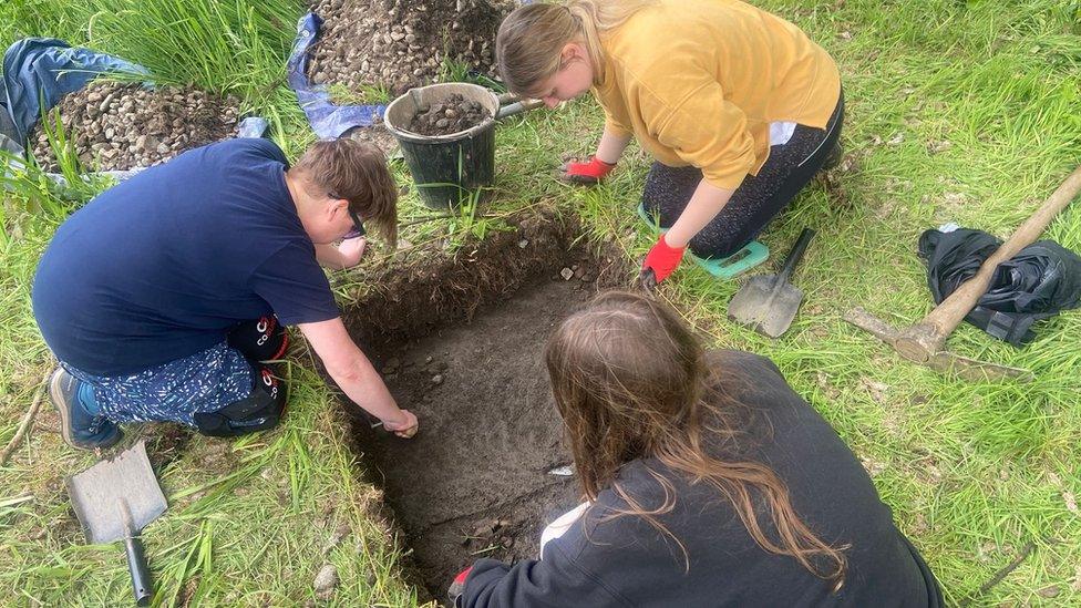 Students on the dig in Festival Park