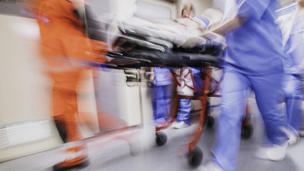 Hospital staff with trolley