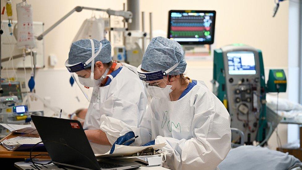 Healthcare workers in a hospital ward