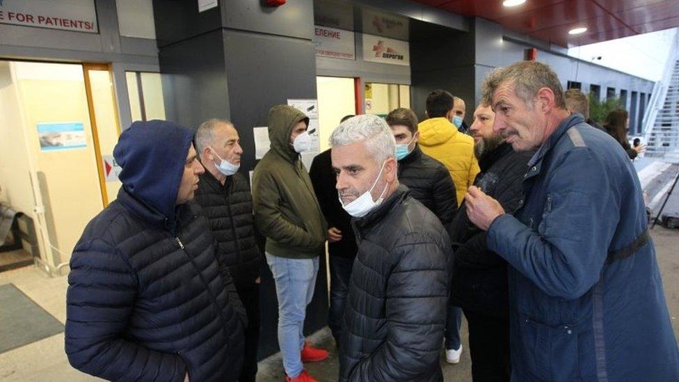 Relatives of passengers injured in the crash gather outside the hospital in Sofia