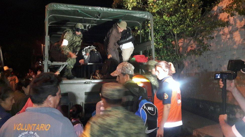 Soldiers and volunteers help residents evacuate homes in Comala, Colima State, Mexico. 1 October 2016