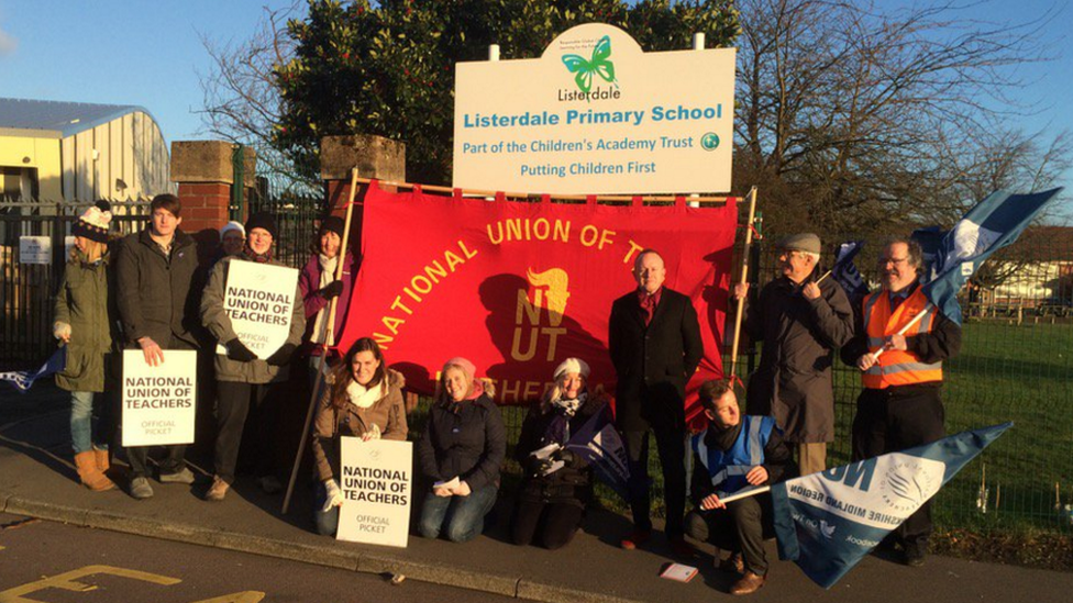 Teachers striking over head teacher's suspension.